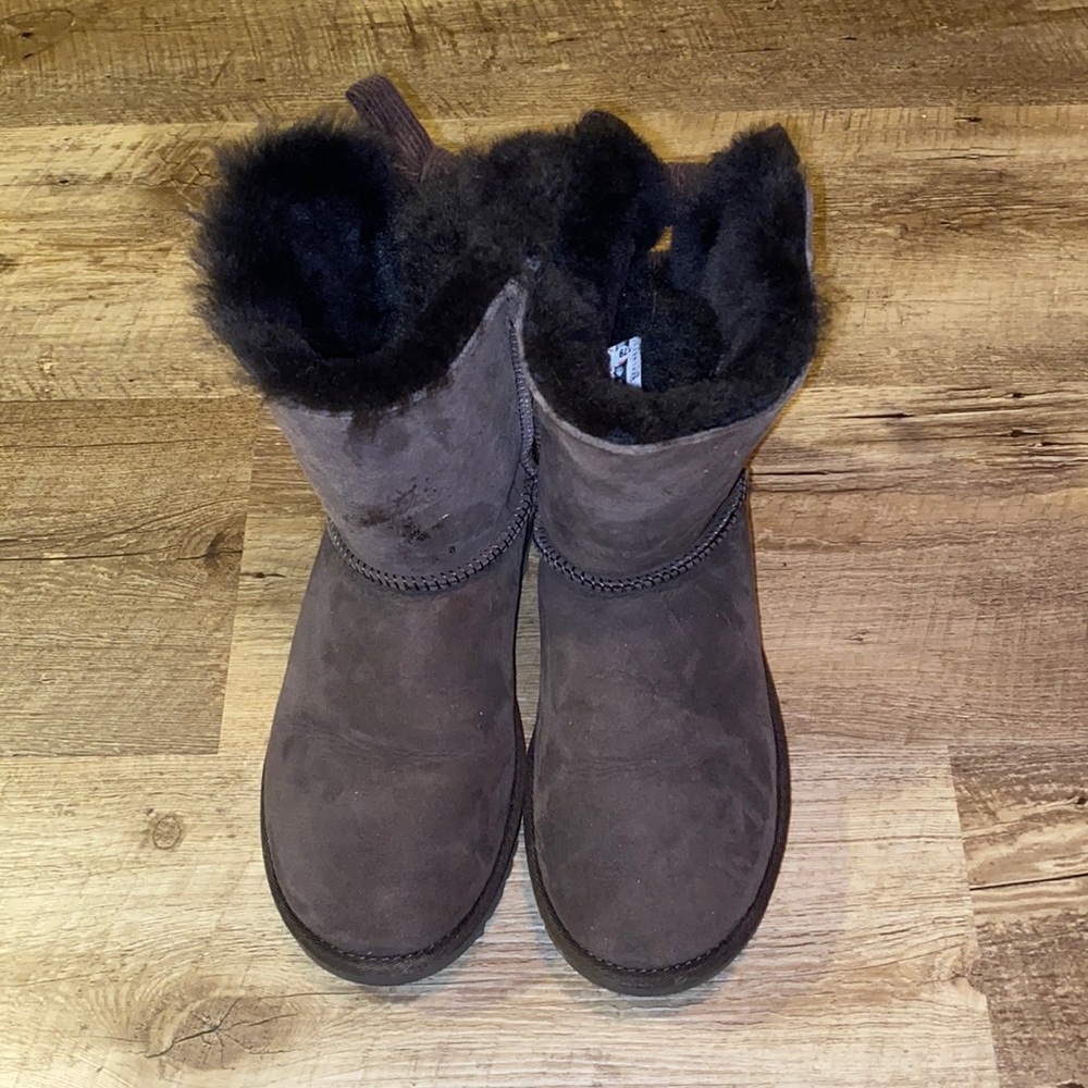 Brown UGG boots with corduroy bow in back